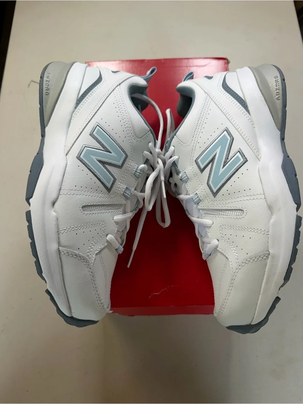 New Balance White and Light Blue Athletic Sneakers